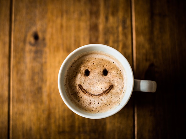 Coffee topped with a smiling face